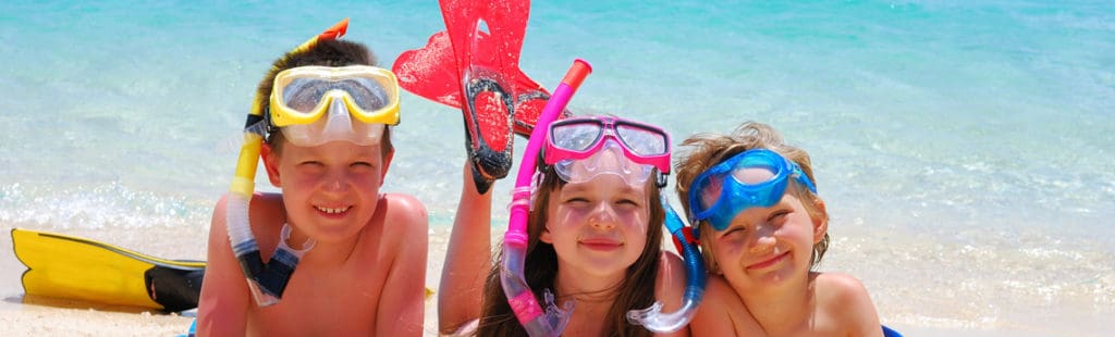 family activities on Maui: children with snorkel masks on beach