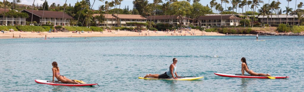 Healthy Maui Vacation: stand up paddlers in the ocean