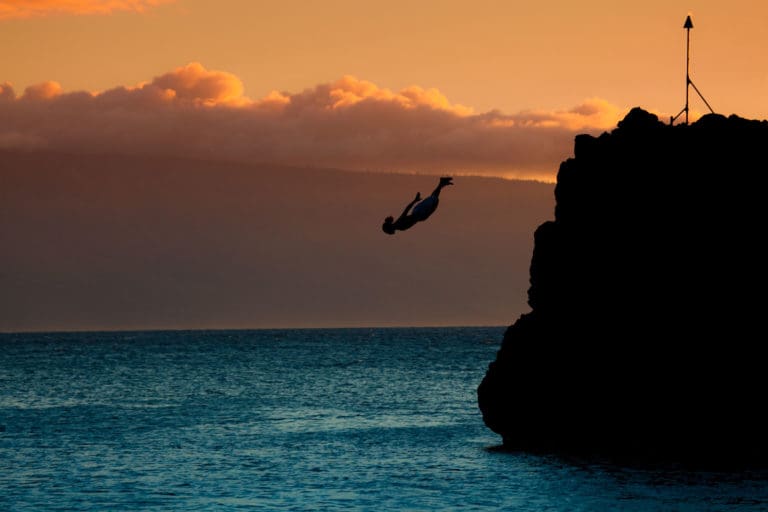 Cliff diver at sunset, Hawaii Maui Guide