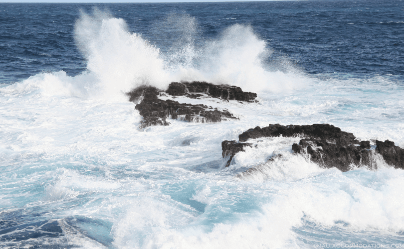 Waves crashing against rocks in Maui, HI