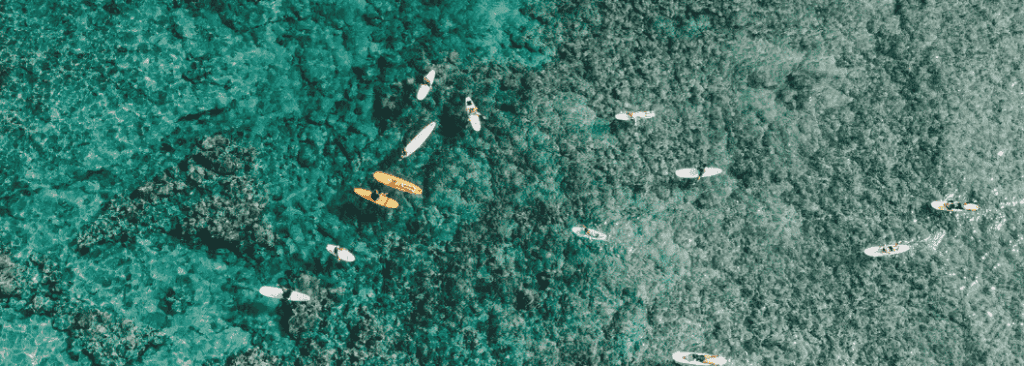 Drone shot down at ocean with surfers