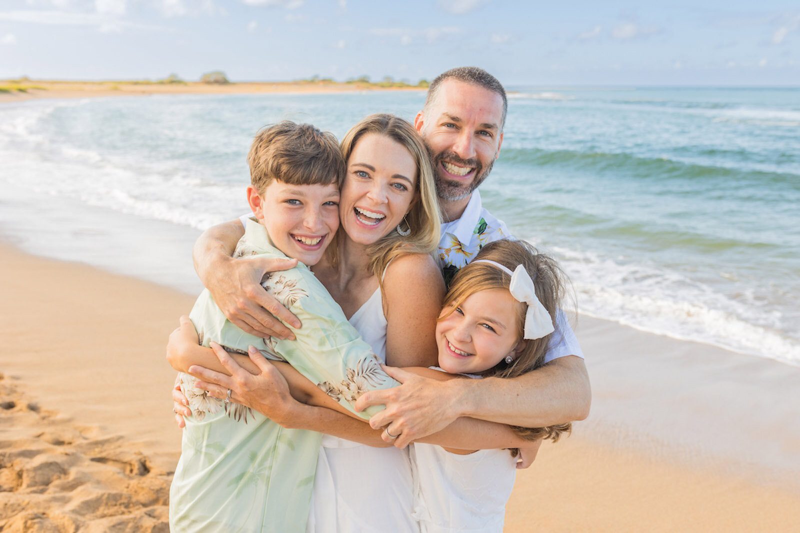 Family Portrait smiling on beach